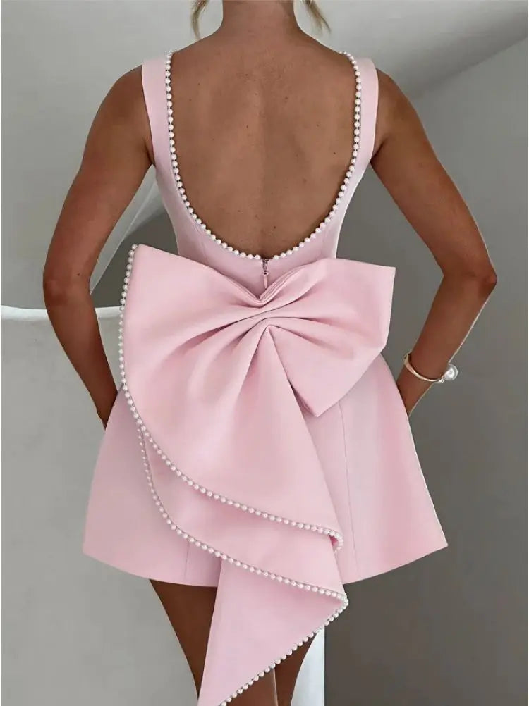 Abito mini rosa in fibra sintetica – schiena scoperta, fiocco removibile, look chic da party